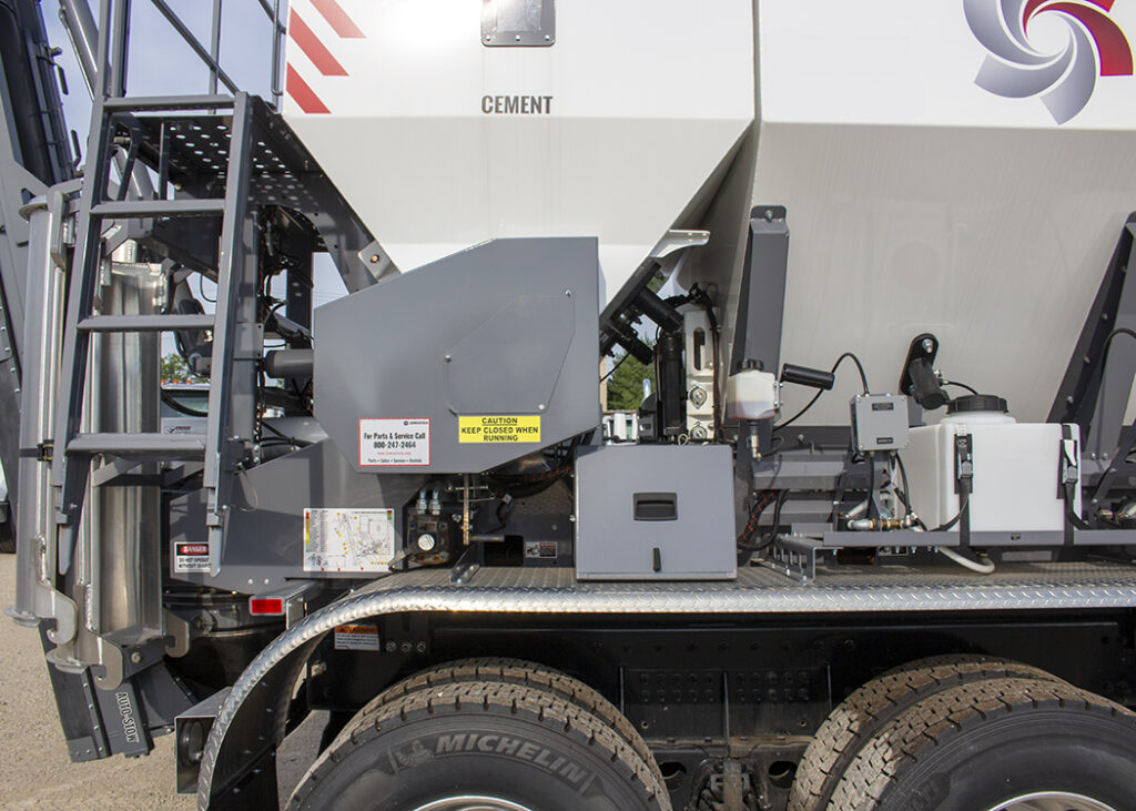 Mobile concrete mixer from Cemen Tech, view of the admix tanks and fiber chopper